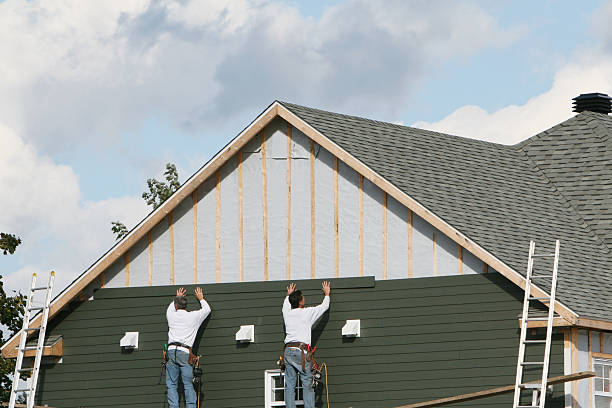 Professional Siding technician working in Rochester, IL